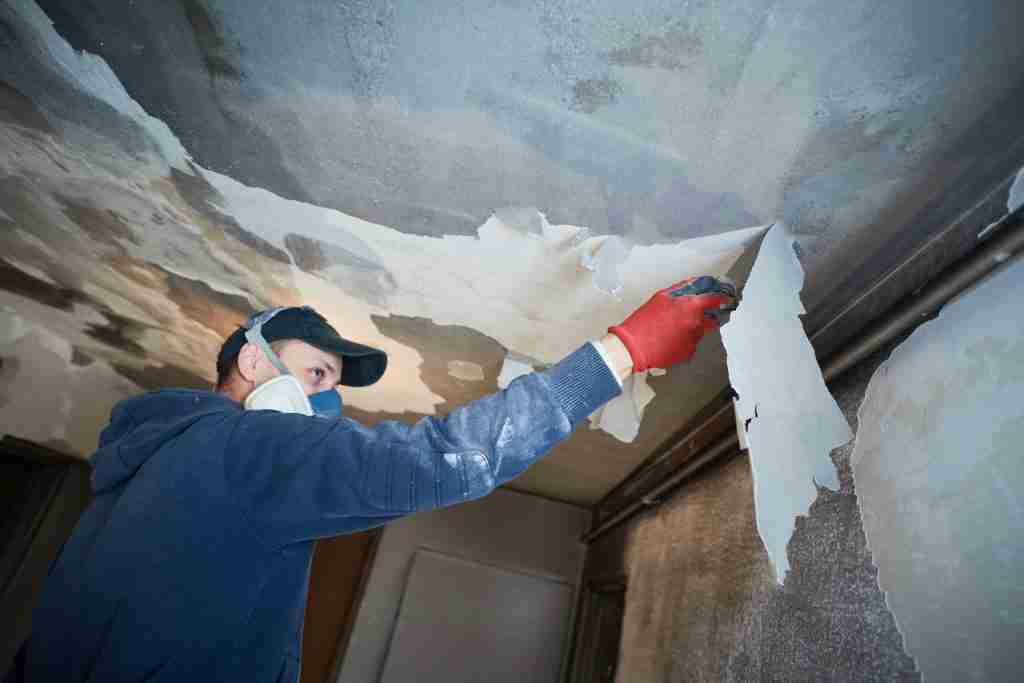 Fire damaged room being cleared during a restoration cleanup